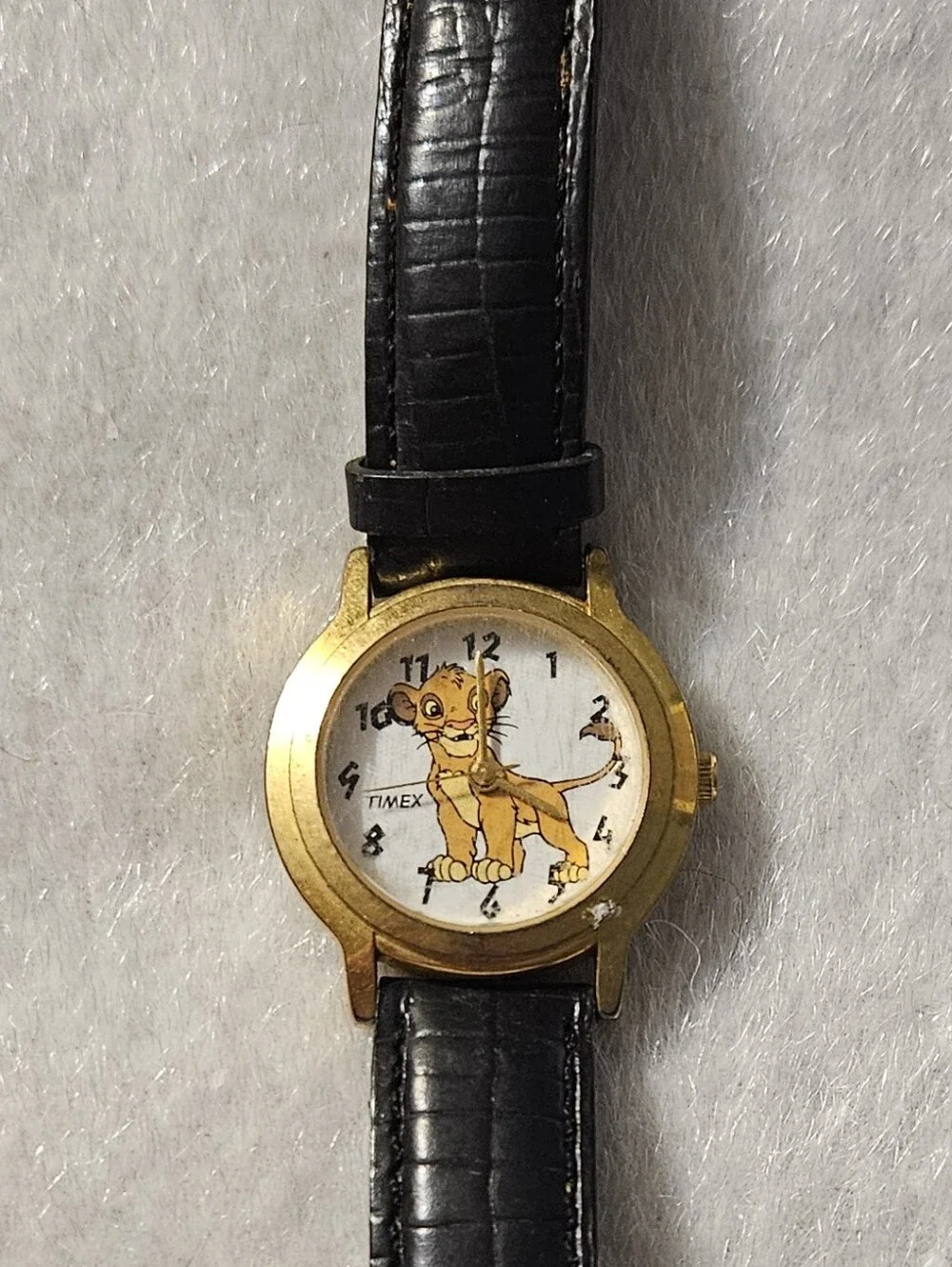 Lion King Timex Gold-Tone Case Watch with Black Leather Strap